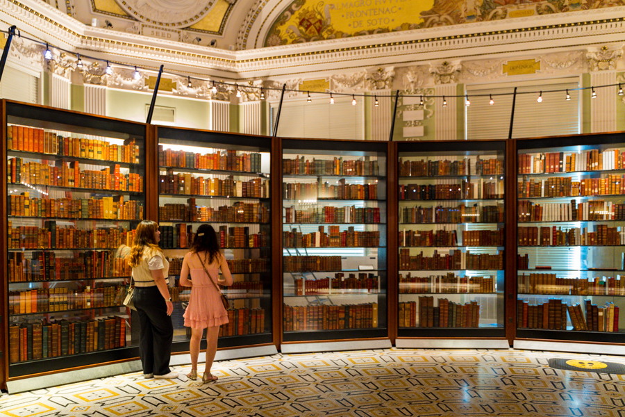 Two people standing in the Library Of Congress