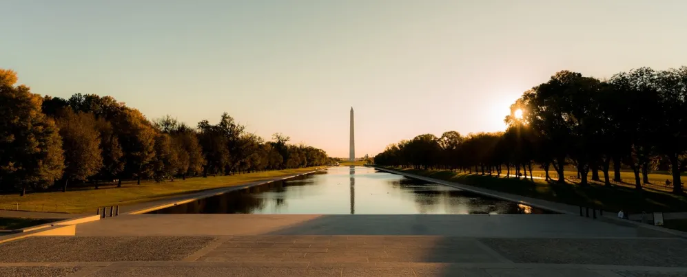 An evening view of the Reflecting Pool, with the Washington Monument in the distance. 
