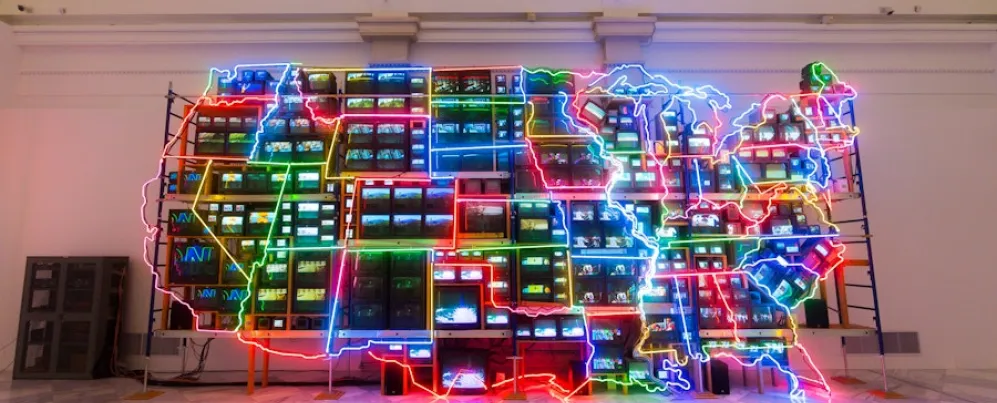The colorful neon and video installation “Electronic Superhighway” by Nam June Paik glows inside the Smithsonian American Art Museum.